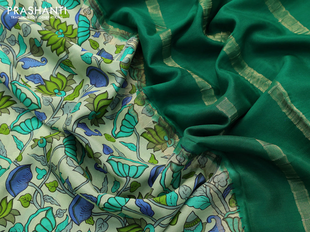 Printed crepe silk saree pastel green and green with allover kalamkari prints and zari woven border