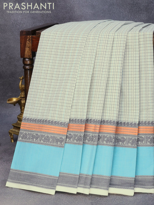 Kanchi cotton saree off white and teal blue with allover thread checks & 1000 buttas and rettapet thread woven border