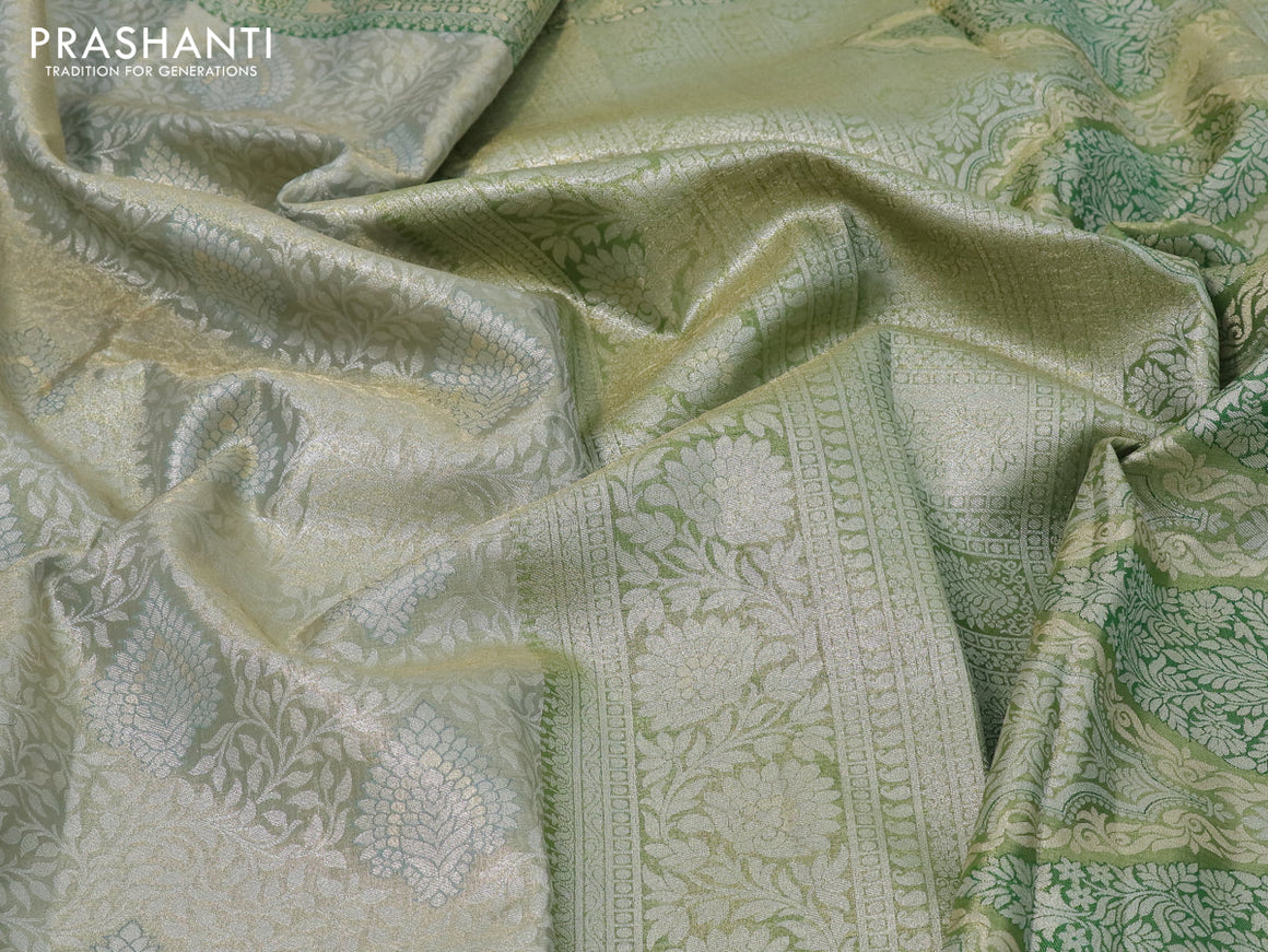 Tissue semi kanjivaram silk saree pastel green and green with allover silver zari woven broacde weaves and silver zari woven border