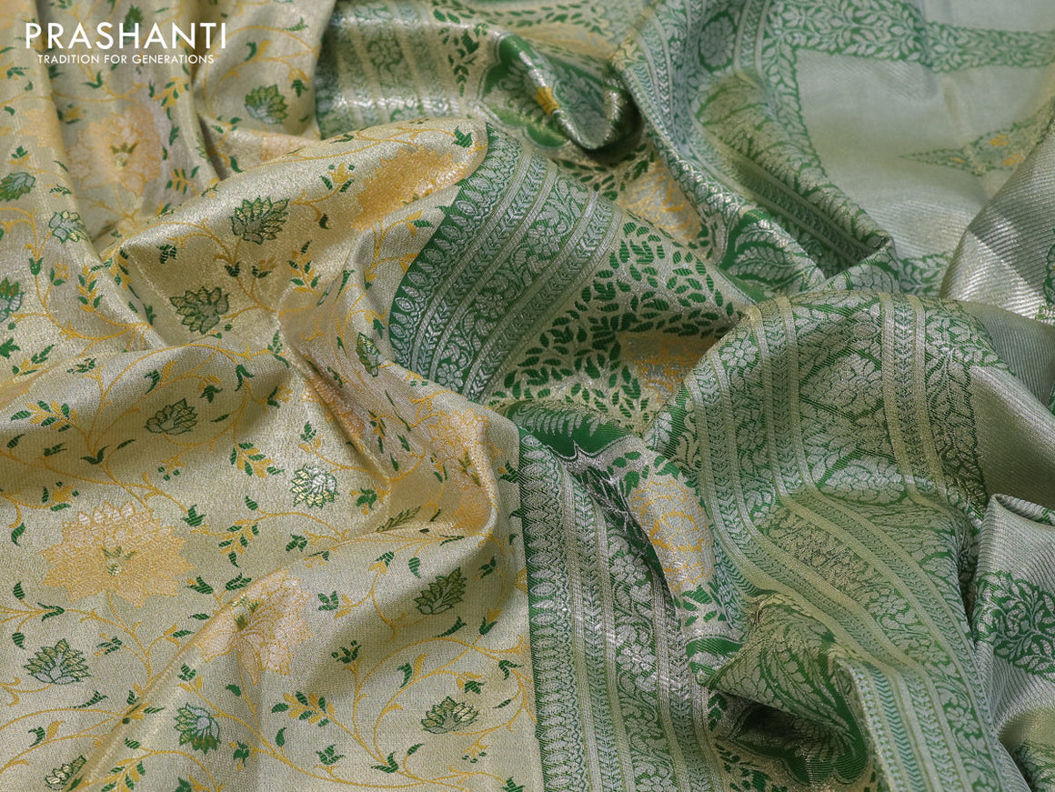 Tissue semi kanjivaram silk saree cream and green shade with allover thread & zari woven floral weaves and long silver zari woven border