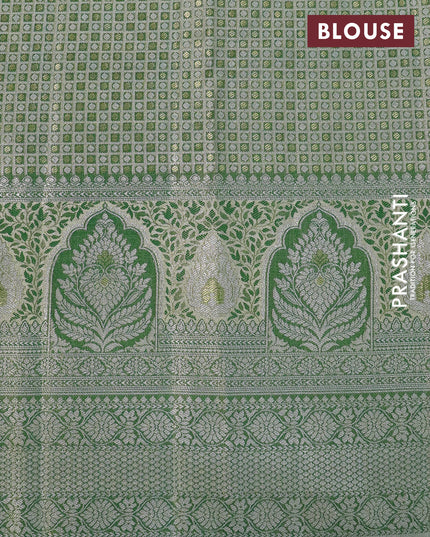 Tissue semi kanjivaram silk saree cream and green shade with allover thread & zari woven floral weaves and long silver zari woven border