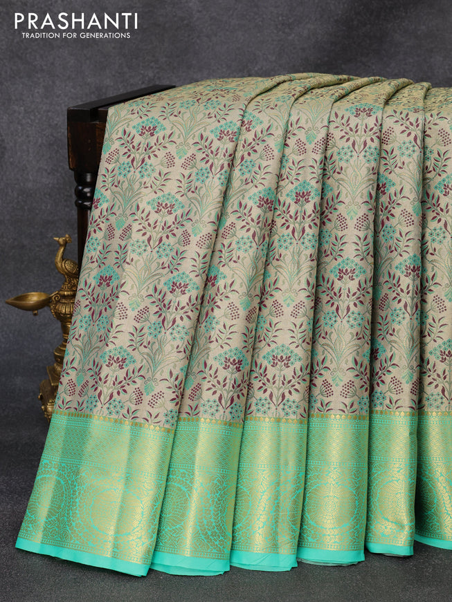 Tissue semi kanjivaram silk saree cream and teal green shade with allover thread & zari woven floral weaves and rich zari woven border