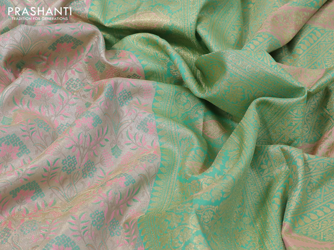 Tissue semi kanjivaram silk saree cream teal shade and teal green shade with allover thread & zari woven floral weaves and rich zari woven border