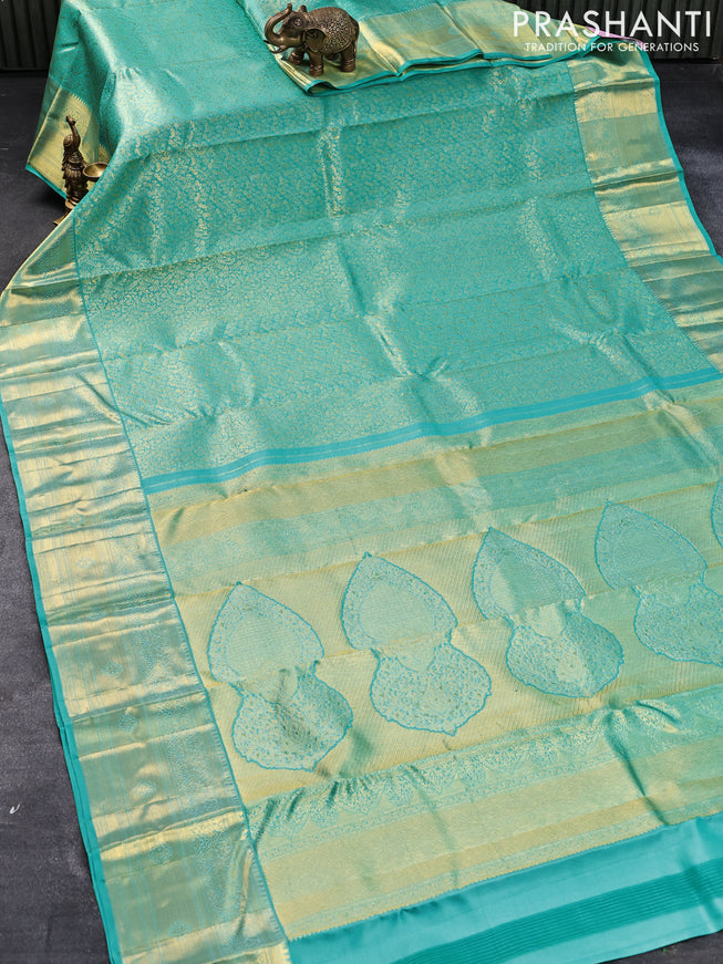 Pure kanjivaram silk saree teal blue with allover zari woven brocade weaves and zari woven border