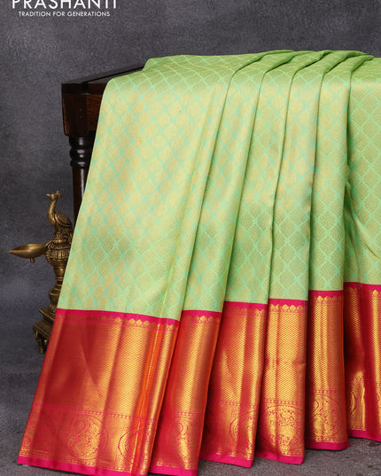 Pure kanjivaram silk saree light green and pink with allover zari woven butta weaves and long zari woven border