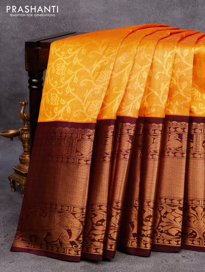 Kuppadam silk cotton saree mango yellow and wine shade with allover self emboss and long zari woven border