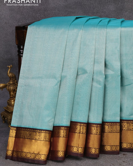 Kuppadam silk cotton saree teal blue and brown with plain body and zari woven border