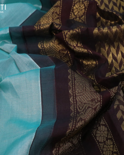 Kuppadam silk cotton saree teal blue and brown with plain body and zari woven border
