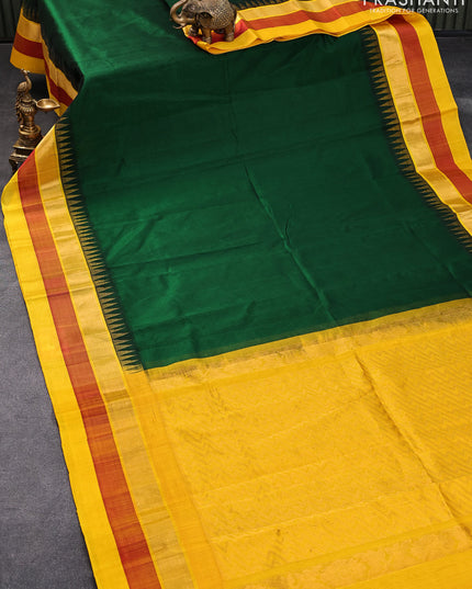 Kuppadam silk cotton saree green and yellow with plain body and temple design zari woven simple border