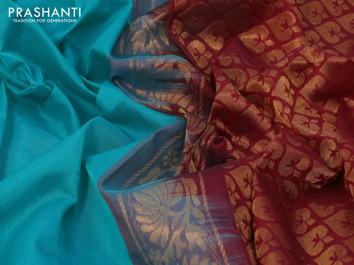 Kuppadam silk cotton saree teal blue and maroon with plain body and temple design long zari woven border