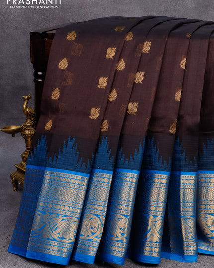 Kuppadam silk cotton saree black and cs blue with allover zari woven buttas and temple design long zari woven annam border