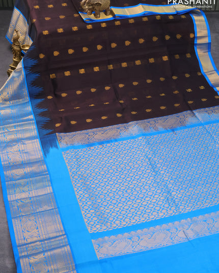Kuppadam silk cotton saree black and cs blue with allover zari woven buttas and temple design long zari woven annam border