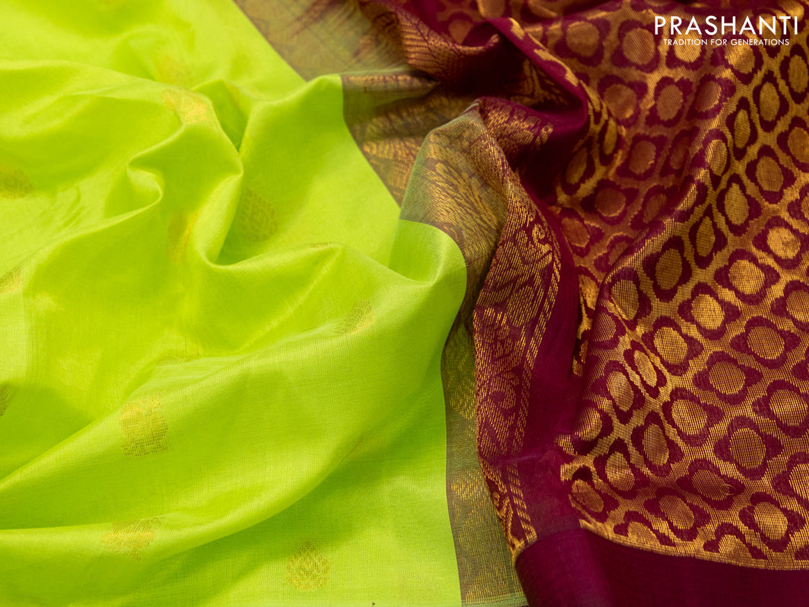 Kuppadam silk cotton saree fluorescent green and maroon with allover zari woven buttas and temple design long zari woven annam border