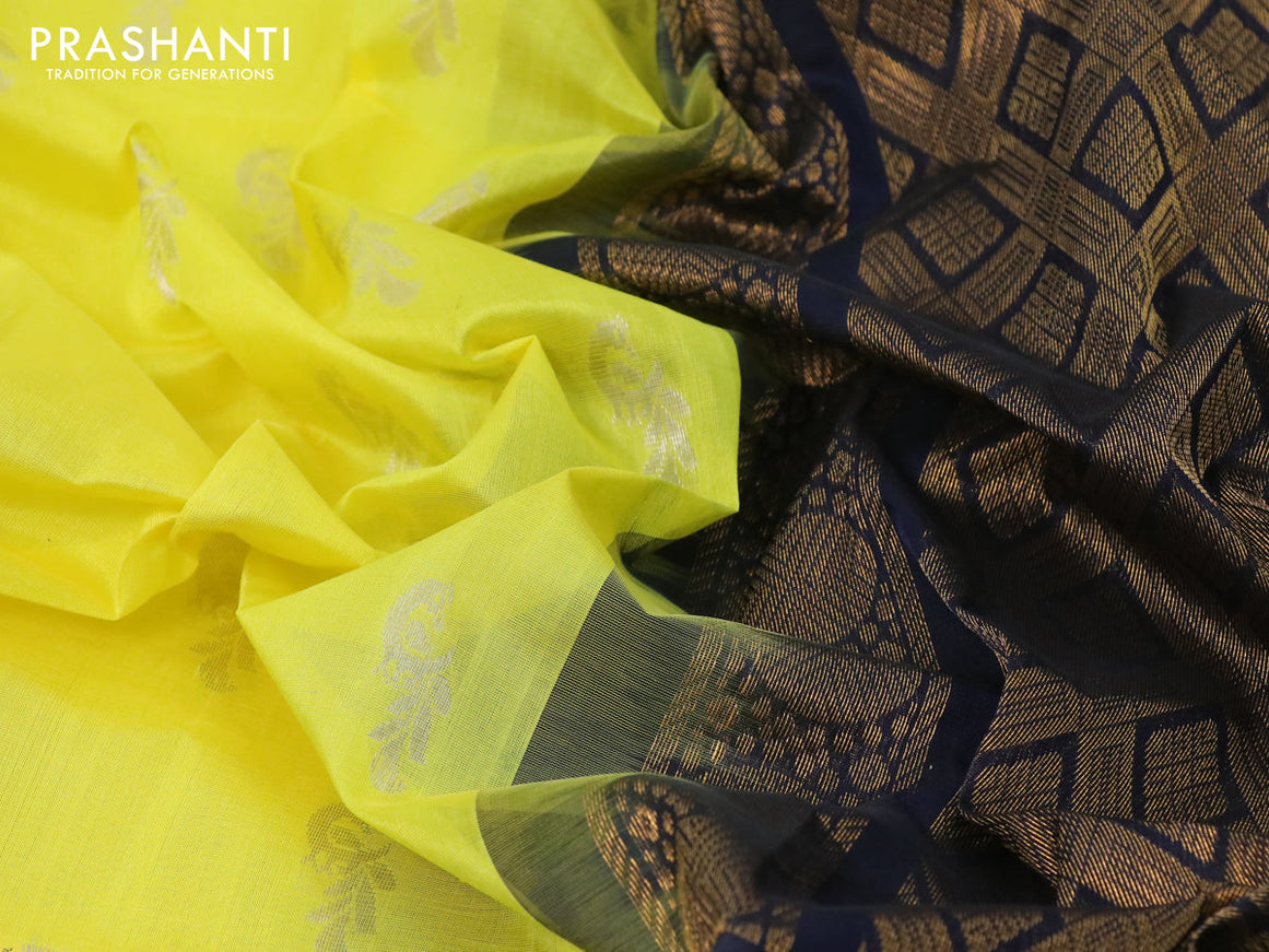 Kuppadam silk cotton saree lime yellow and navy blue with silver zari woven buttas and temple design long zari woven border