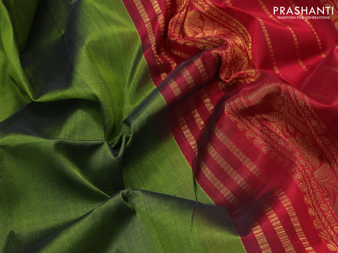 Silk cotton saree metallic green and maroon with plain body and zari woven korvai border