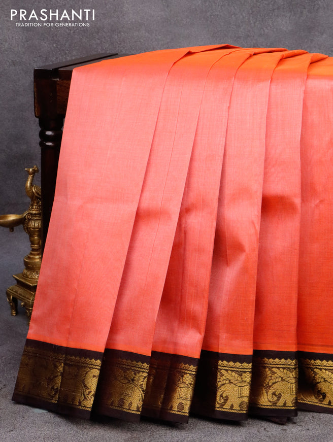 Silk cotton saree peach pinkish orange and deep wine shade with plain body and zari woven korvai border