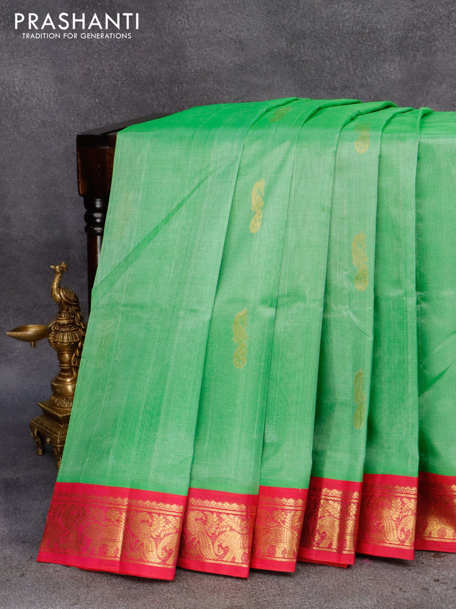 Silk cotton saree light green and pink with peacock zari woven buttas and zari woven korvai border