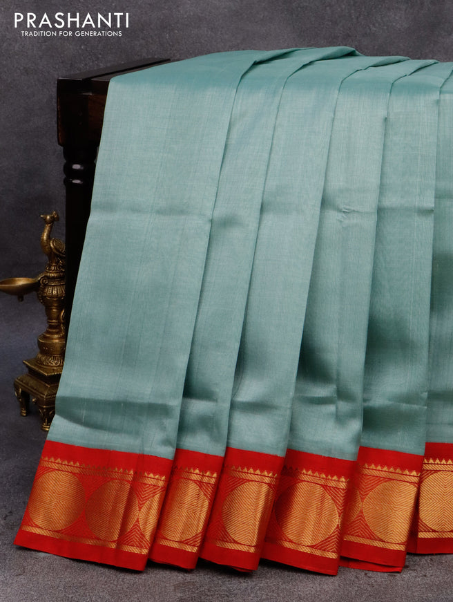 Silk cotton saree pastel blue and red with plain body and rudhraksha zari woven korvai border