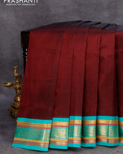 Silk cotton saree deep maroon and teal blue with plain body and zari woven korvai border