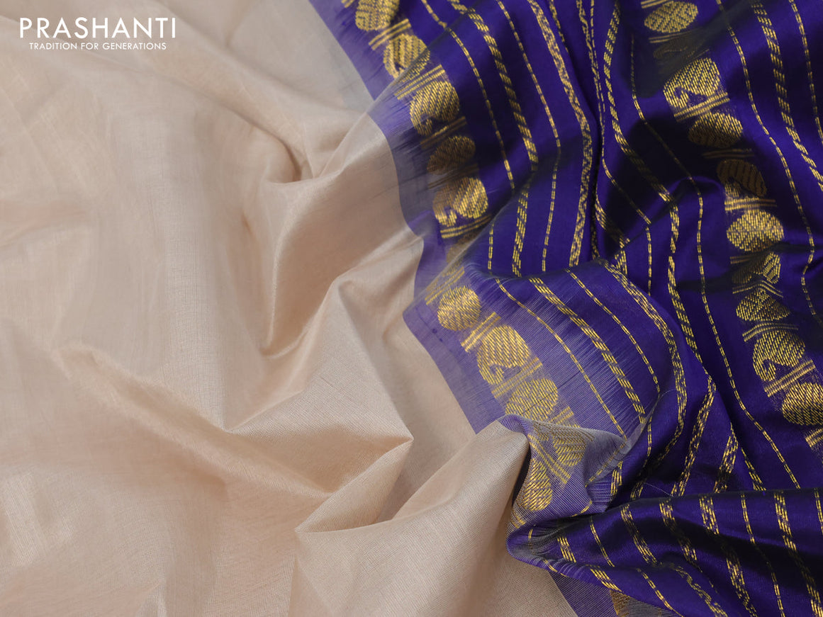 Silk cotton saree beige and blue with plain body and zari woven korvai border