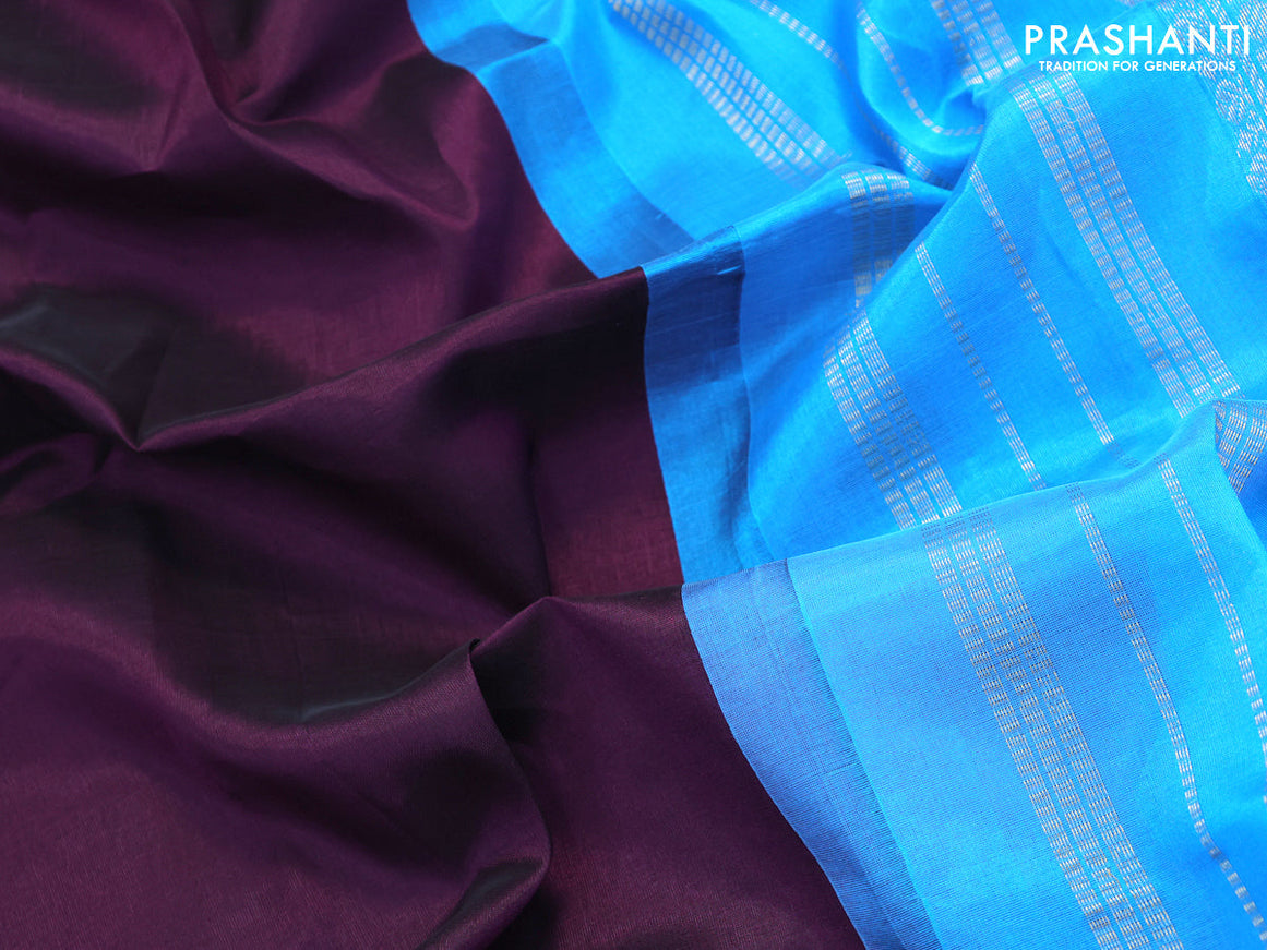 Silk cotton saree deep violet and light blue with plain body and zari woven korvai border