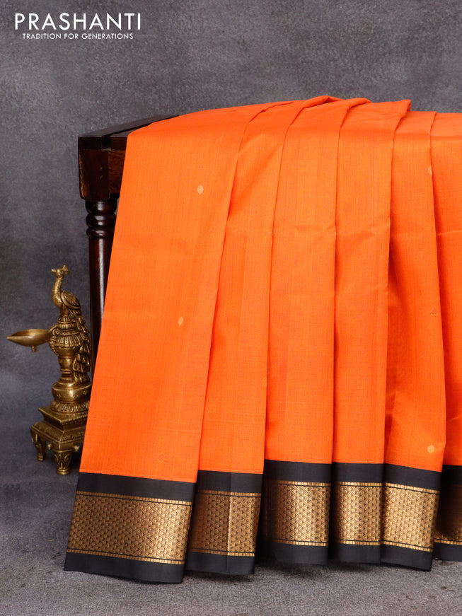 Silk cotton saree orange and black with plain body and zari woven korvai border