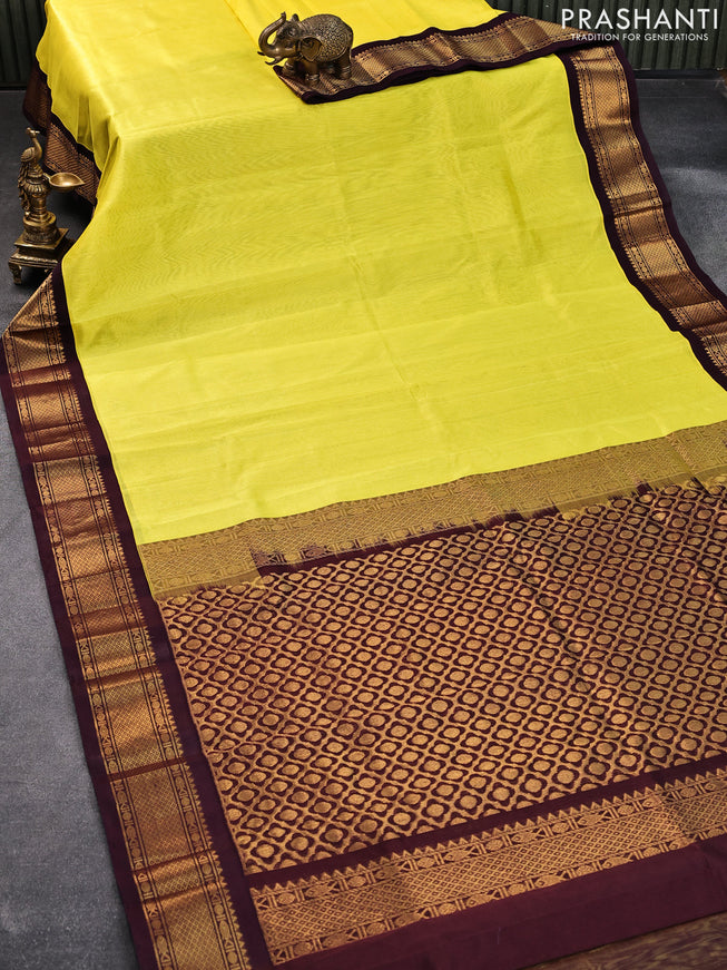 Silk cotton saree lime yellow and wine shade with plain body and zari woven korvai border