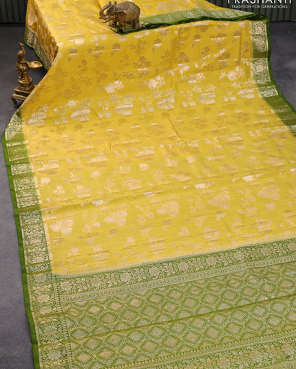 Chiniya silk saree yellow and green with allover zari woven floral weaves and zari woven border