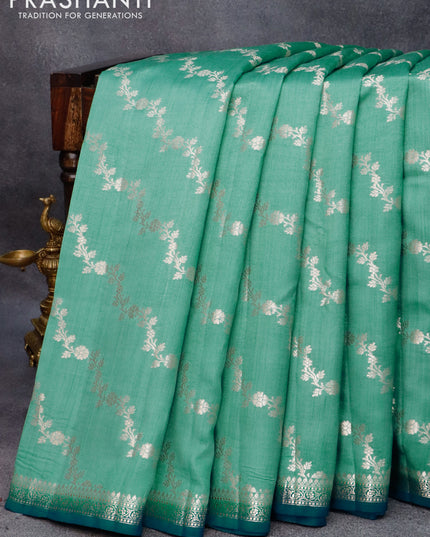Chiniya silk saree teal shade and peacock blue with allover zari weaves and small zari woven border