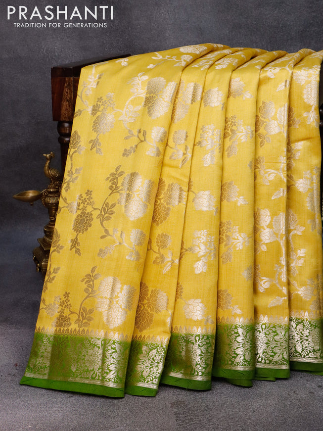 Chiniya silk saree yellow and green with allover floral zari weaves and zari woven border
