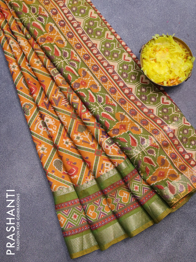 Semi tussar saree mustard yellow and green with allover patola prints and zari woven border
