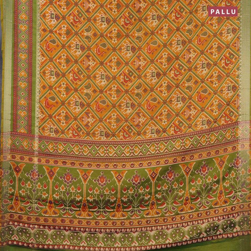 Semi tussar saree mustard yellow and green with allover patola prints and zari woven border