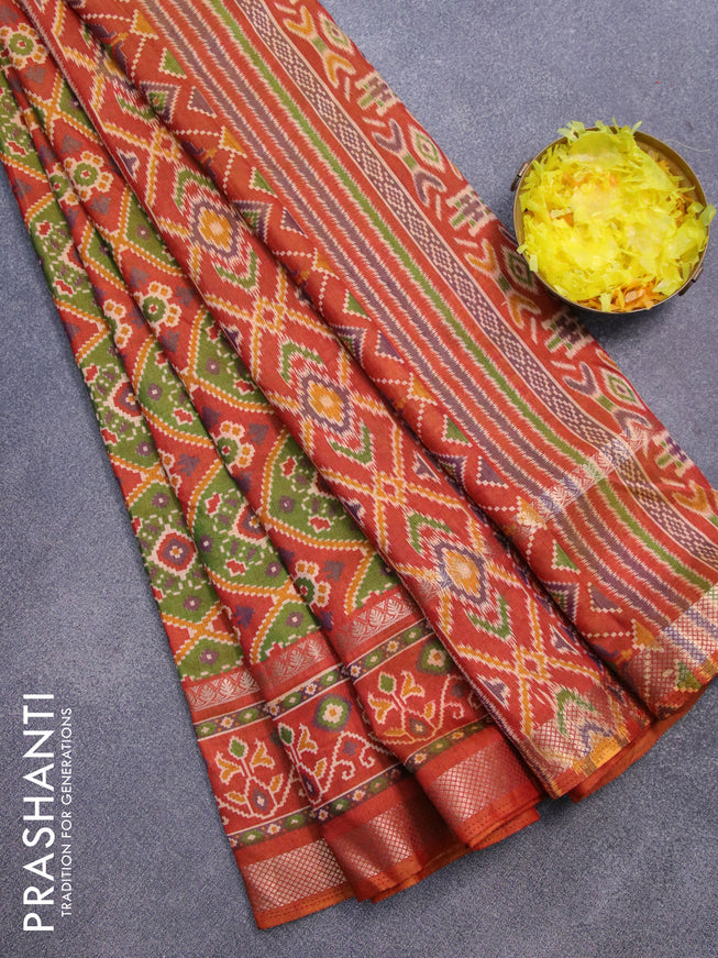 Semi tussar saree green and rust shade with allover ikat prints and rettapet zari woven border