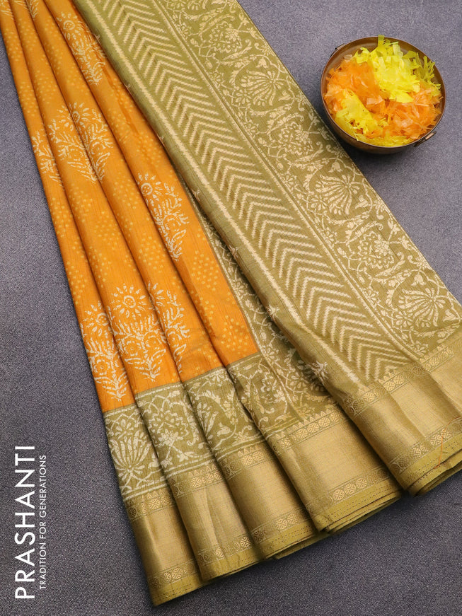 Semi tussar saree mango yellow and mehendi green with allover butta prints and zari woven border