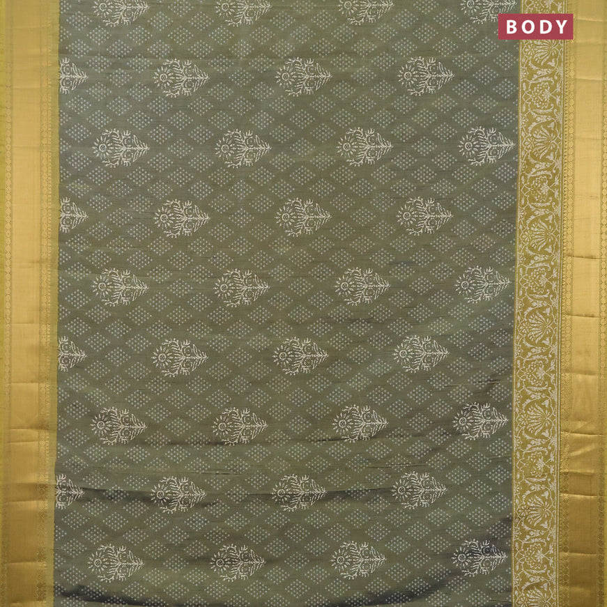 Semi tussar saree dual shade of greyish green shade and mehendi green with allover butta prints and zari woven border