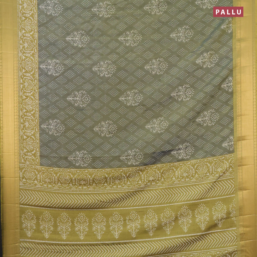 Semi tussar saree dual shade of greyish green shade and mehendi green with allover butta prints and zari woven border