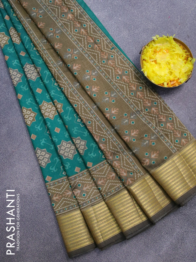 Semi tussar saree teal green and dark khaki shade with allover ikat prints and zari woven border