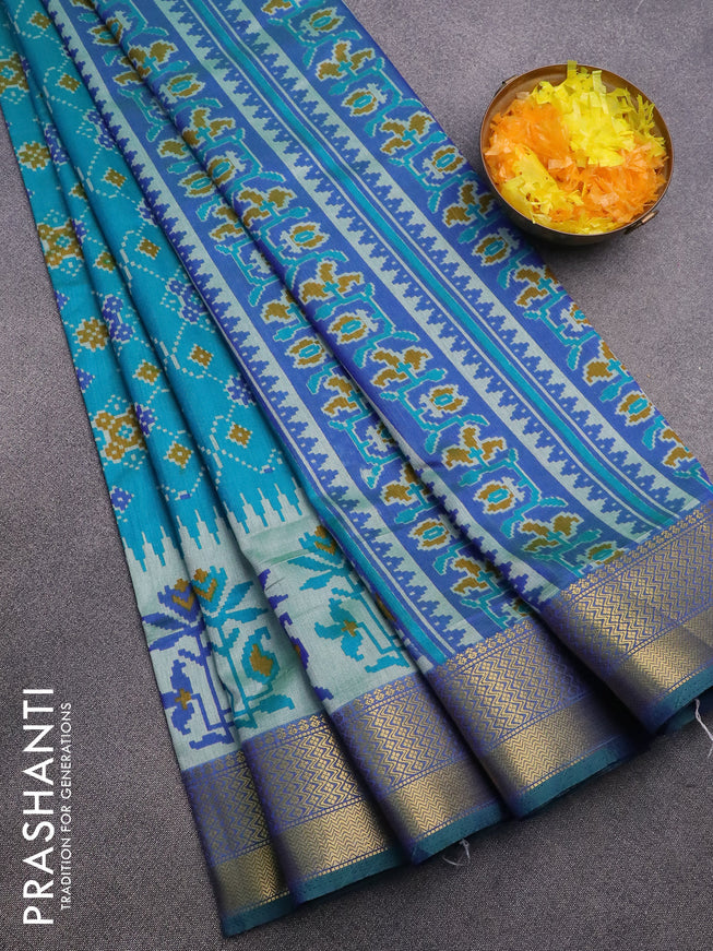 Semi tussar saree dual shade of tealbluish green and dual shade of blue with allover ikat prints and zari woven border