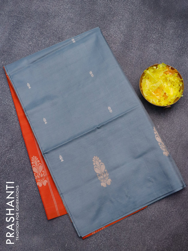 Banana pith saree grey and sunset orange with thread woven buttas in borderless style