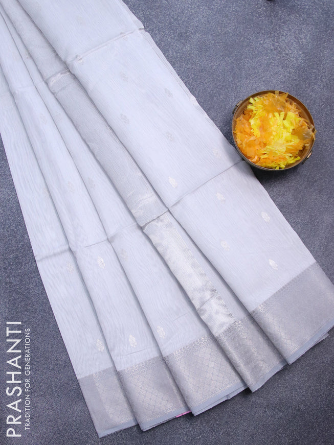 Maheshwari silk cotton saree pastel grey shade with silver zari woven buttas and silver zari woven border