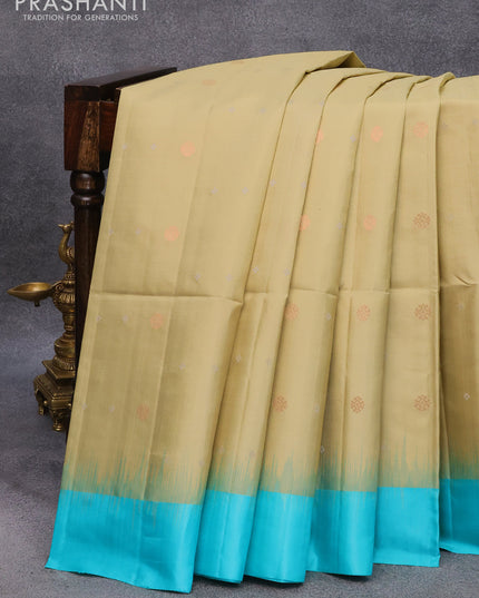 Pure soft silk saree elaichi green shade and teal blue with allover silver & copper zari buttas and simple border