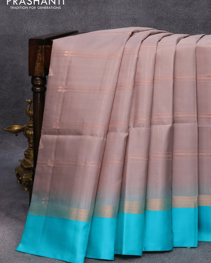 Pure soft silk saree grey shade and teal blue with allover checks & copper zari woven buttas and simple border
