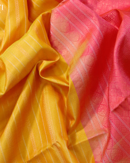 Pure soft silk saree mango yellow and dual shade od pinkish orange with allover silver & copper zari weaves and silver & copper zari woven butta border
