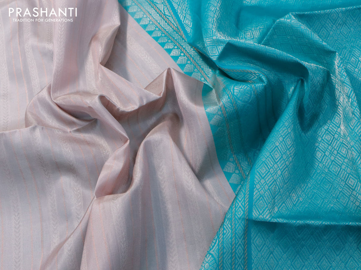 Pure soft silk saree pastel grey and teal blue with allover silver & copper zari weaves and silver & copper zari woven butta border