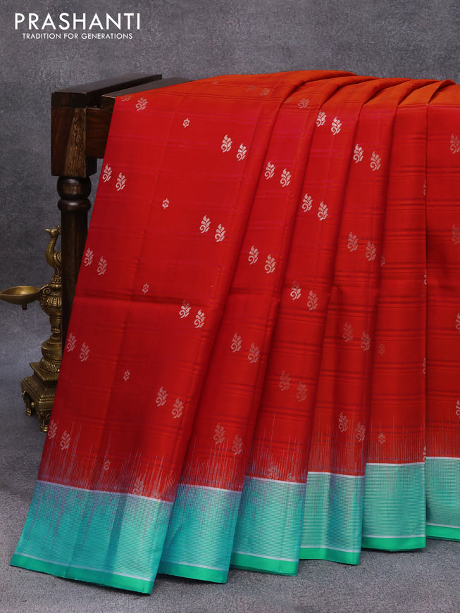 Pure soft silk saree dual shade of pinkish orange and teal blue with allover silver zari buttas and silver zari woven border