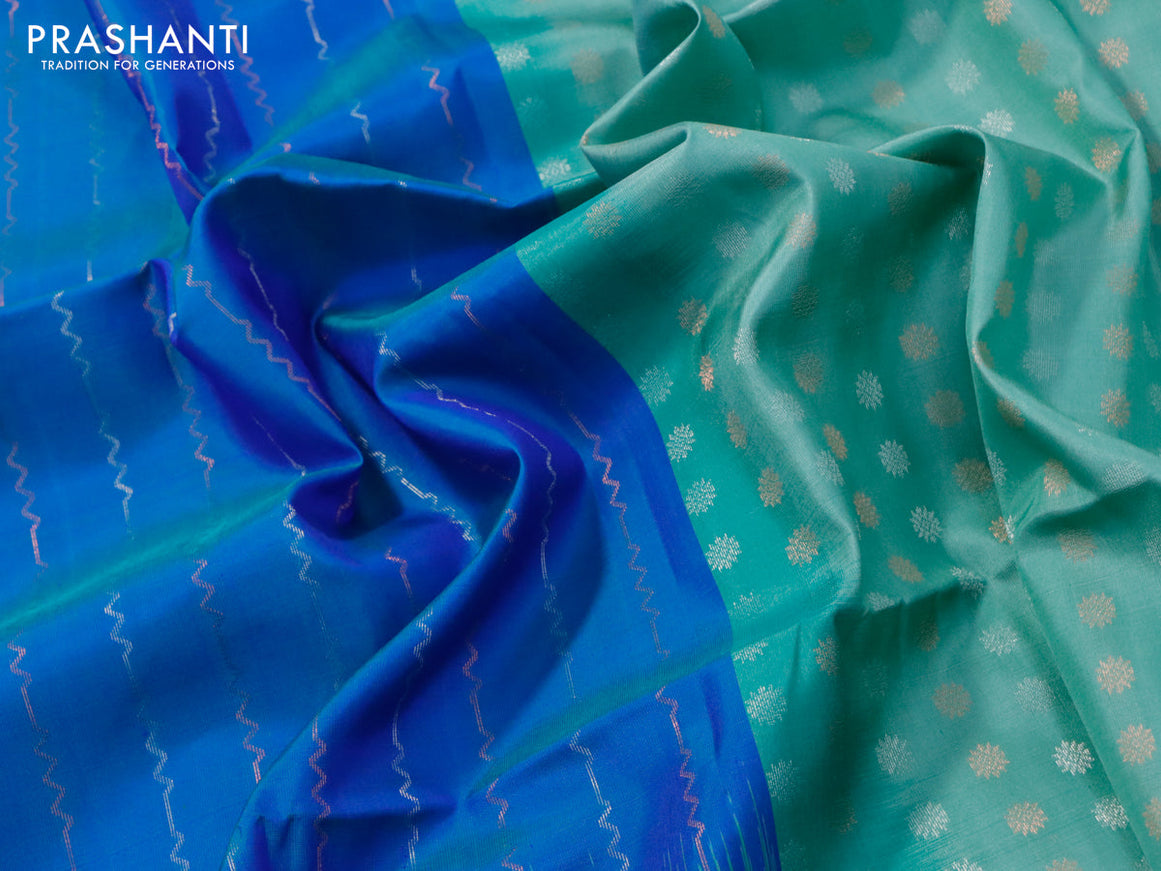 Pure soft silk saree dual shade of blue and pastel green with allover silver & copper zari weaves and long silver & copper zari woven butta border