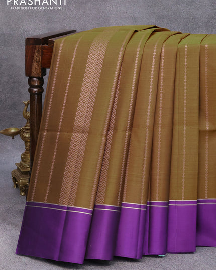 Pure soft silk saree dark mehendi green and violet with allover copper zari weaves and zari woven simple border