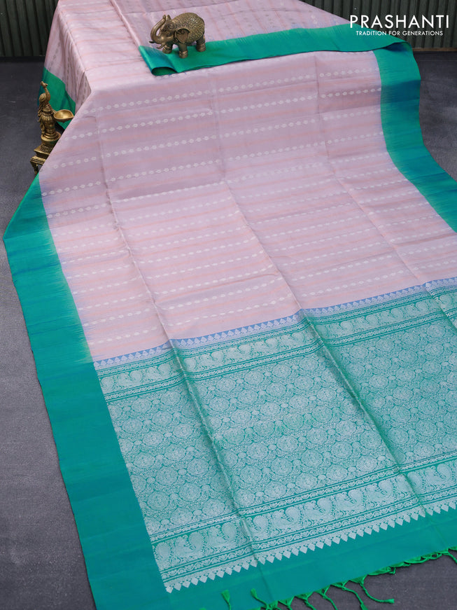 Pure soft silk saree pastel shade of pink and dual shade of bluish green with allover silver & copper zari weaves ans simple border