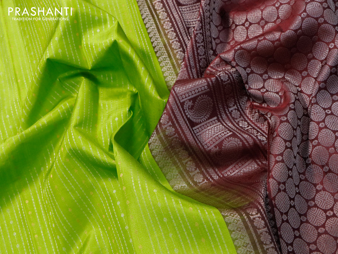 Pure soft silk saree light green and deep maroon with allover silver & copper zari weaves and long silver & copper zari woven butta border