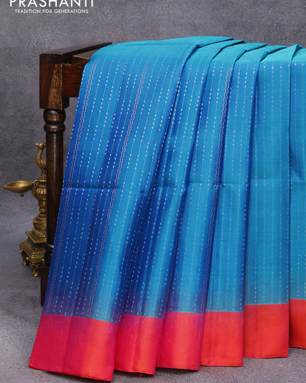 Pure soft silk saree dual shade of blue and dual shade of pinkish orange with allover silver & copper zari weaves and simple border